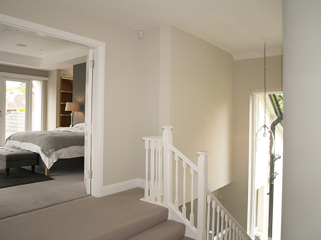 Upstairs landing views to split level master bedroom