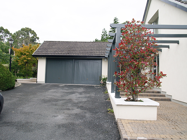 Spacious double garage to side of house