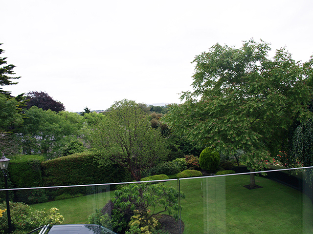 Upstairs balcony overlooking mature garden