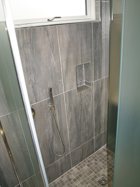 Stylish shower facilities to rear of master bed