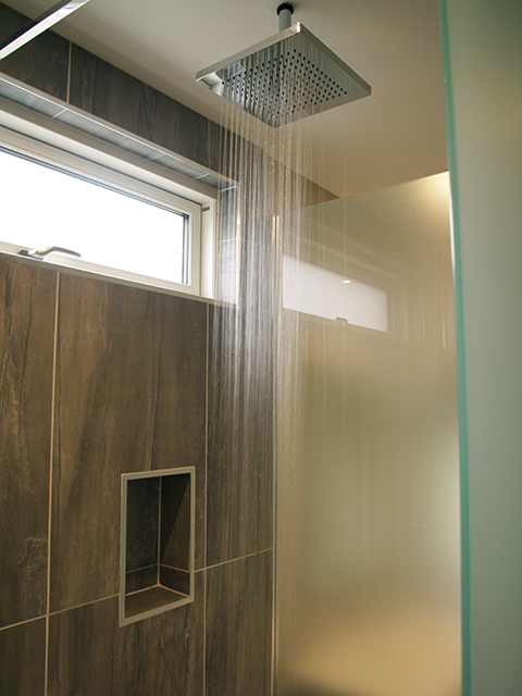 Stylish shower facilities to rear of master bed