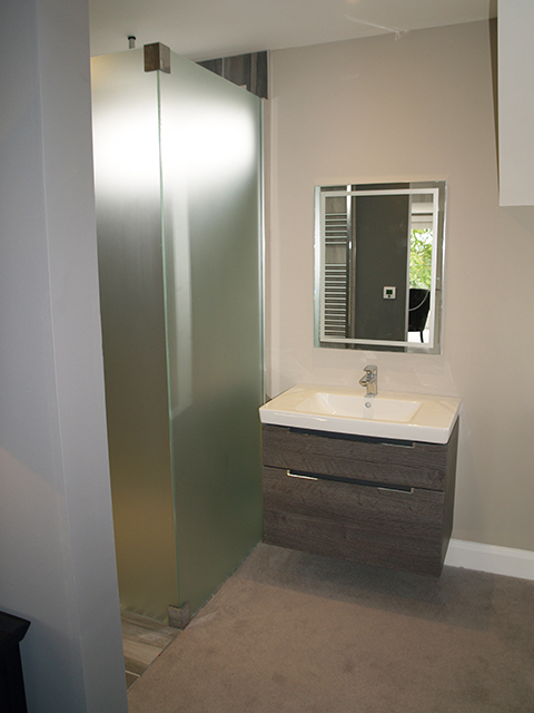 Contemporary wash hand basin to right of master bed