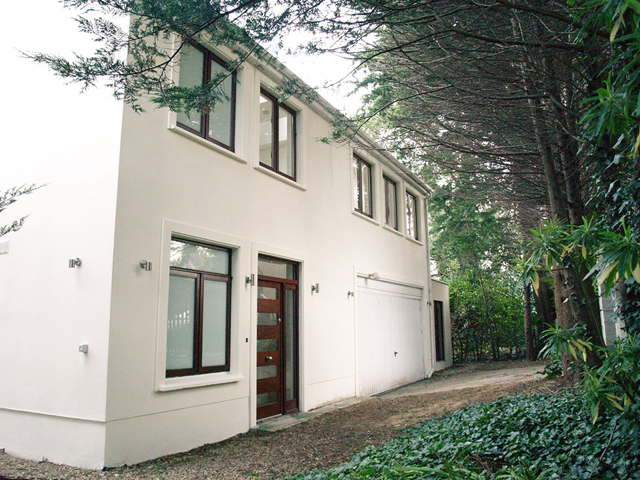 Mews front entrance with double garage