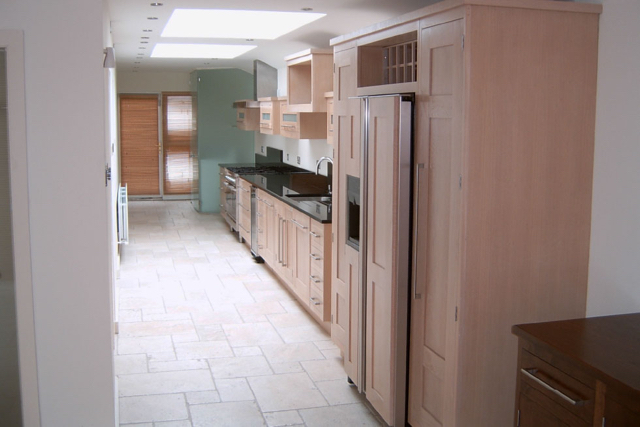 Galley kitchen with glass utility