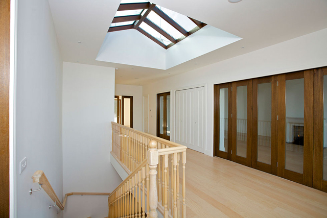 Upper reception hall with folding doors