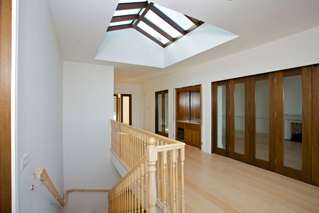 Upper reception hall with folding doors