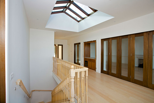 Upper reception hall with folding doors