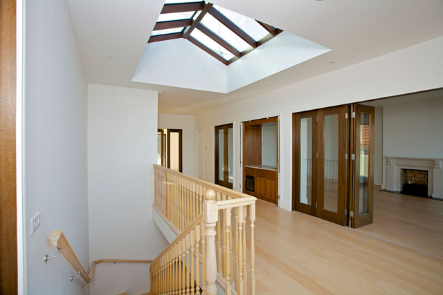 Upper reception hall with folding doors