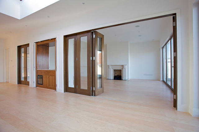 Upper reception hall with folding doors