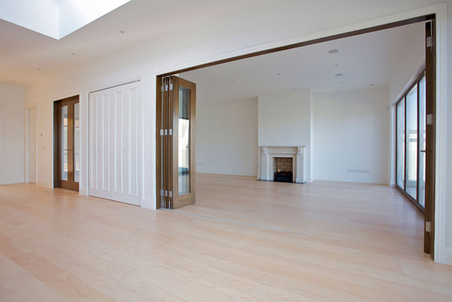 Upper reception hall with folding doors